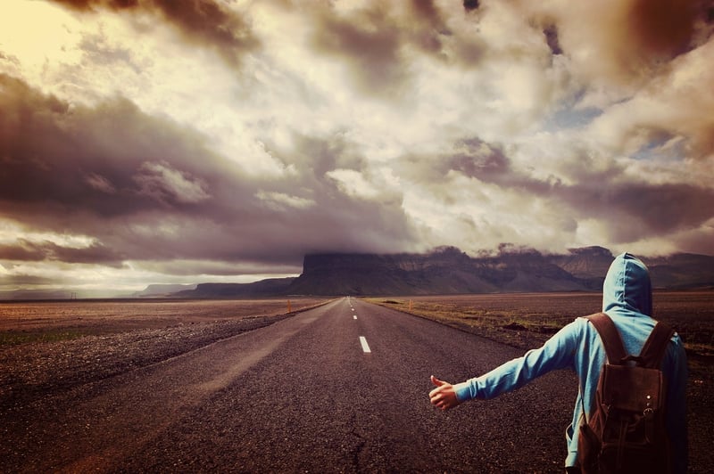 Hitchhiker on a Mountain Road